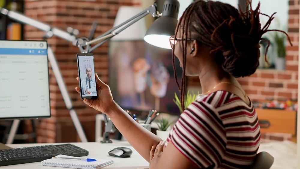 A patient on a tablet during a virtual telehealth visit