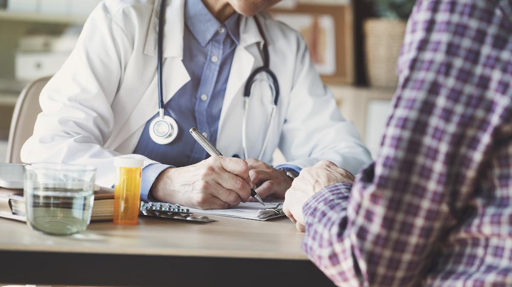 A medication blister pack on a clinical surface, suggesting prescription opioid use.